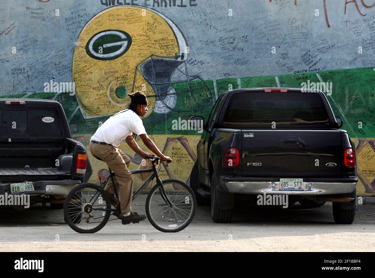 In this 2005 file photo, Nate Palode bikes past Dolly's Service and