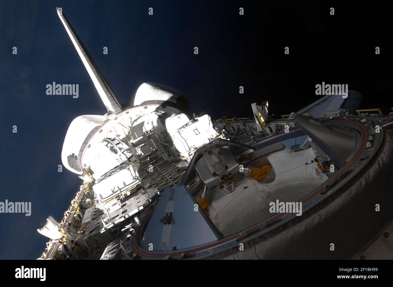 Backdropped by the blackness of space, a partial view of Space Shuttle ...
