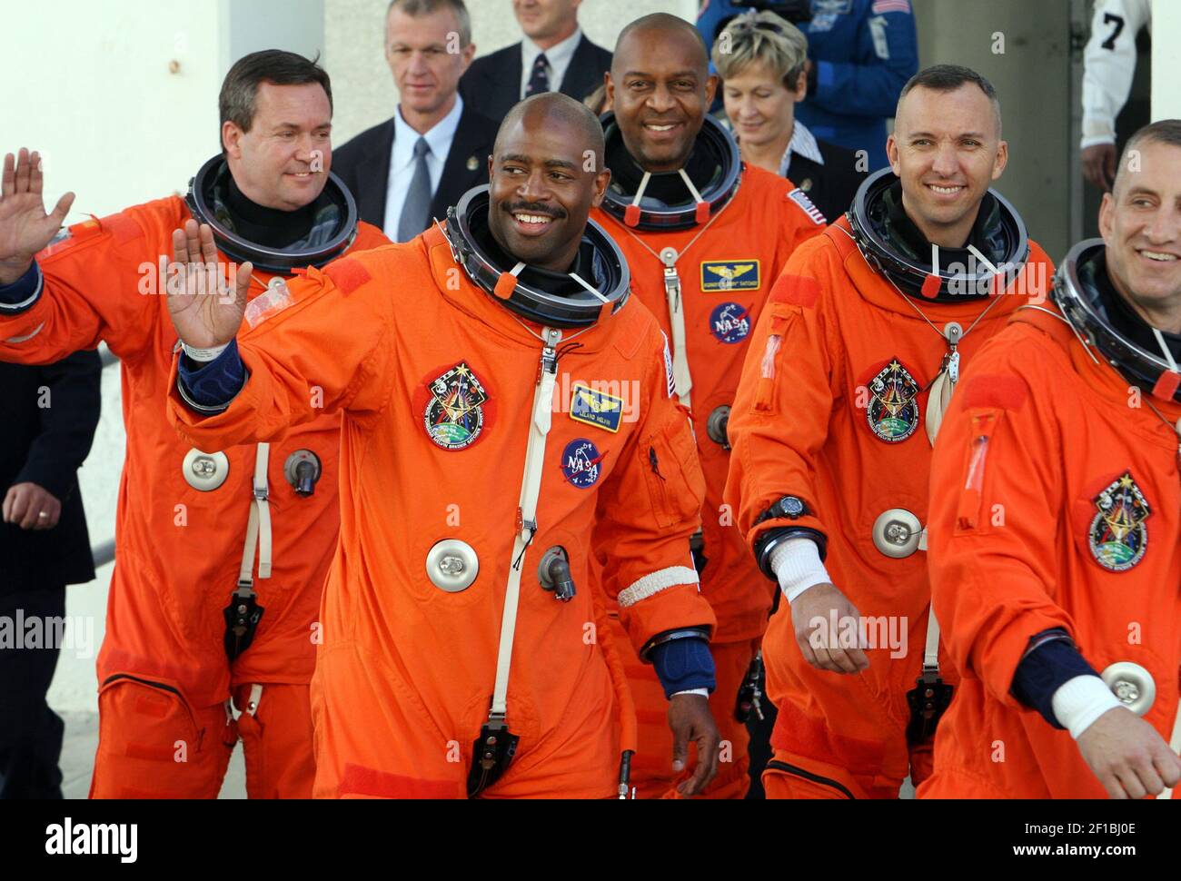 Space shuttle Atlantis astronaut Leland Melvin, second from left, waves as the crew of 6 head to climb aboard shuttle Atlantis at the Kennedy Space Center in Florida, Monday, November 16, 2009. (Photo by Red Huber/Orlando Sentinel/MCT/Sipa USA) Stock Photo