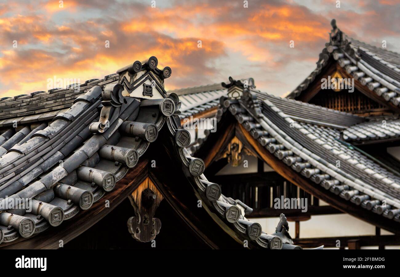 Sunset over the rooftops of historic Gion, Kyoto, Japan. Detail or the traditional Japanese architecture. Stock Photo