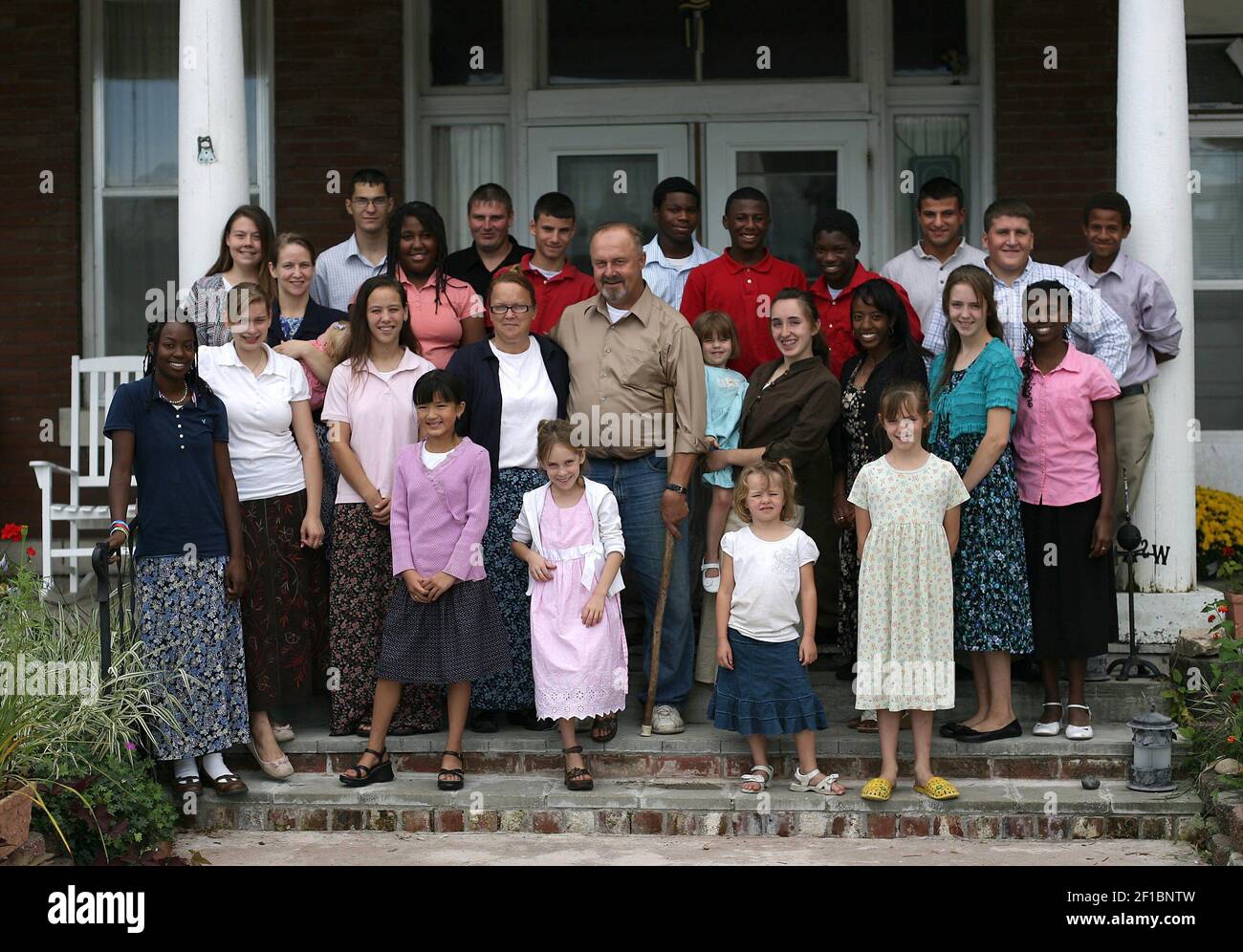 Tom and Debra Ritter, center, pose for a photograph in front of the ...