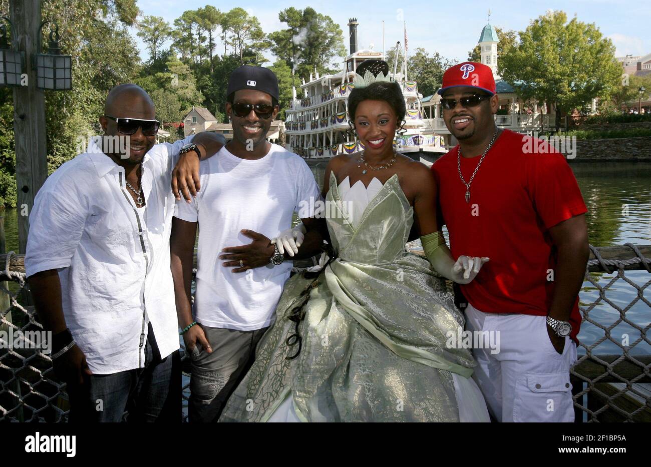 Princess Tiana, center right, greets members of R&B group Boyz II Men  during her debut day in the Magic Kingdom, at Walt Disney World, Monday,  October 26, 2009. From left, Wanya Morris,