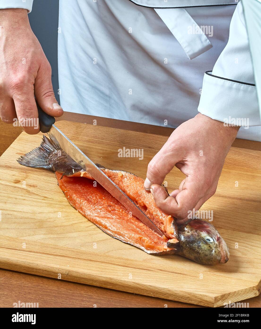 Wooden Cutting Board full of Fish Scales and Fish Fillet Preparations  cutting head of fish with Traditional Indigenous Same Knife after fishing  trip Stock Photo - Alamy