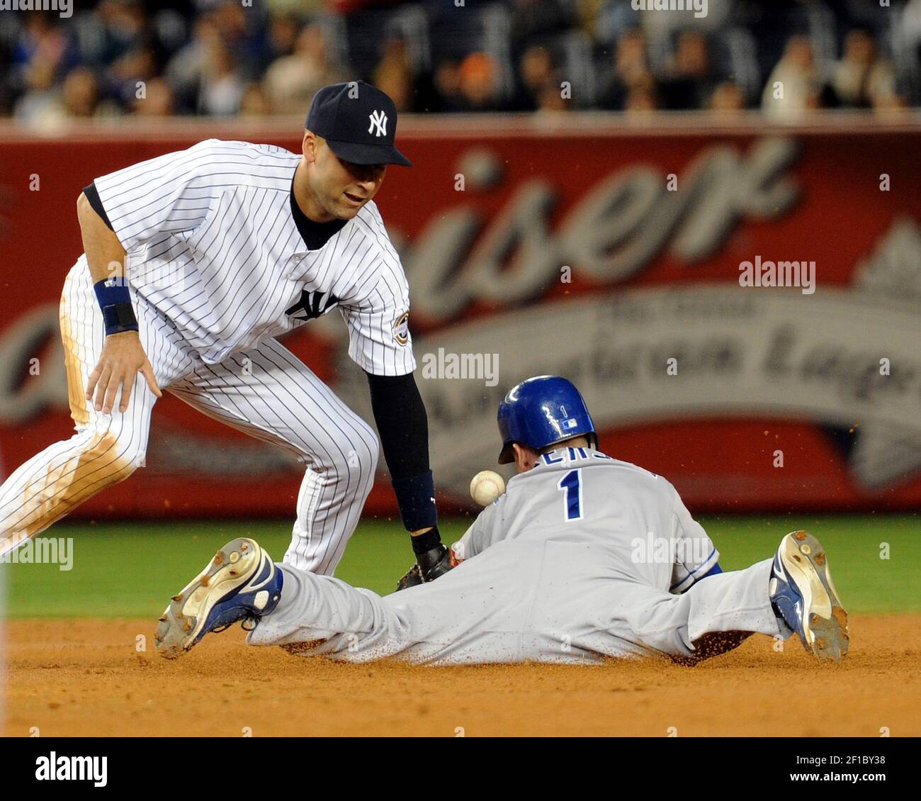 Kansas City Royals' Alex Gordon (4) makes an error on a ball hit by  New York Yankees' Derek Jeter (2) in the first inning, Tuesday,  September 29, 2009, at Yankee Stadium in