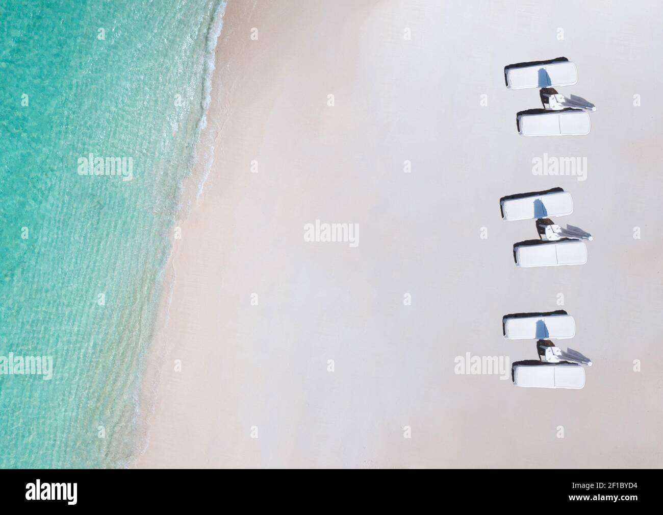 Aerial tropical white sand beach background with turquoise blue water and sun beads Stock Photo