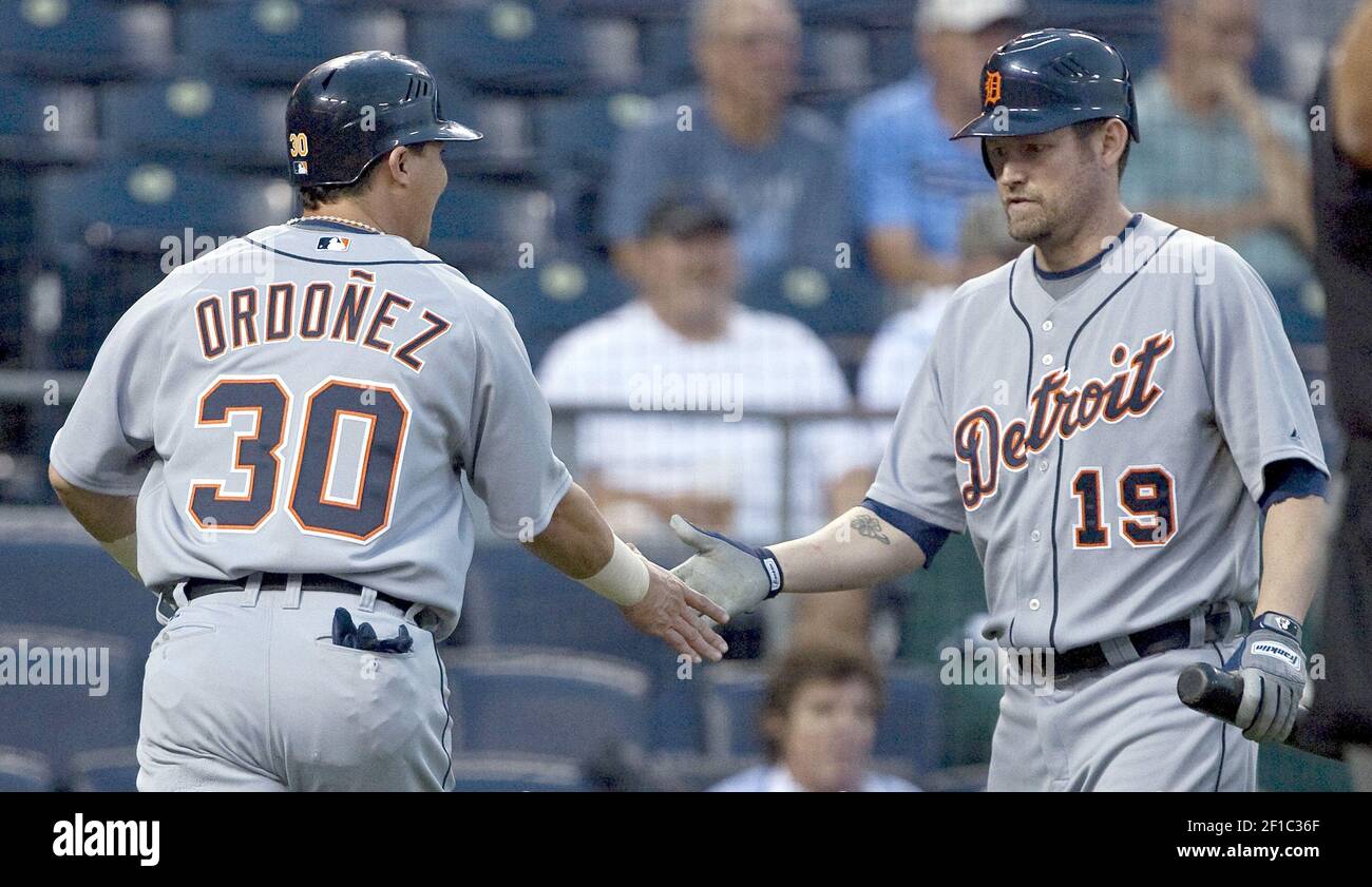 Detroit Tigers' Placido Polanco, right, is congratulated by Miguel Cabrera  after scoring in the third inning of a baseball game against the Kansas  City Royals, Saturday, Aug. 30, 2008, in Detroit. (AP