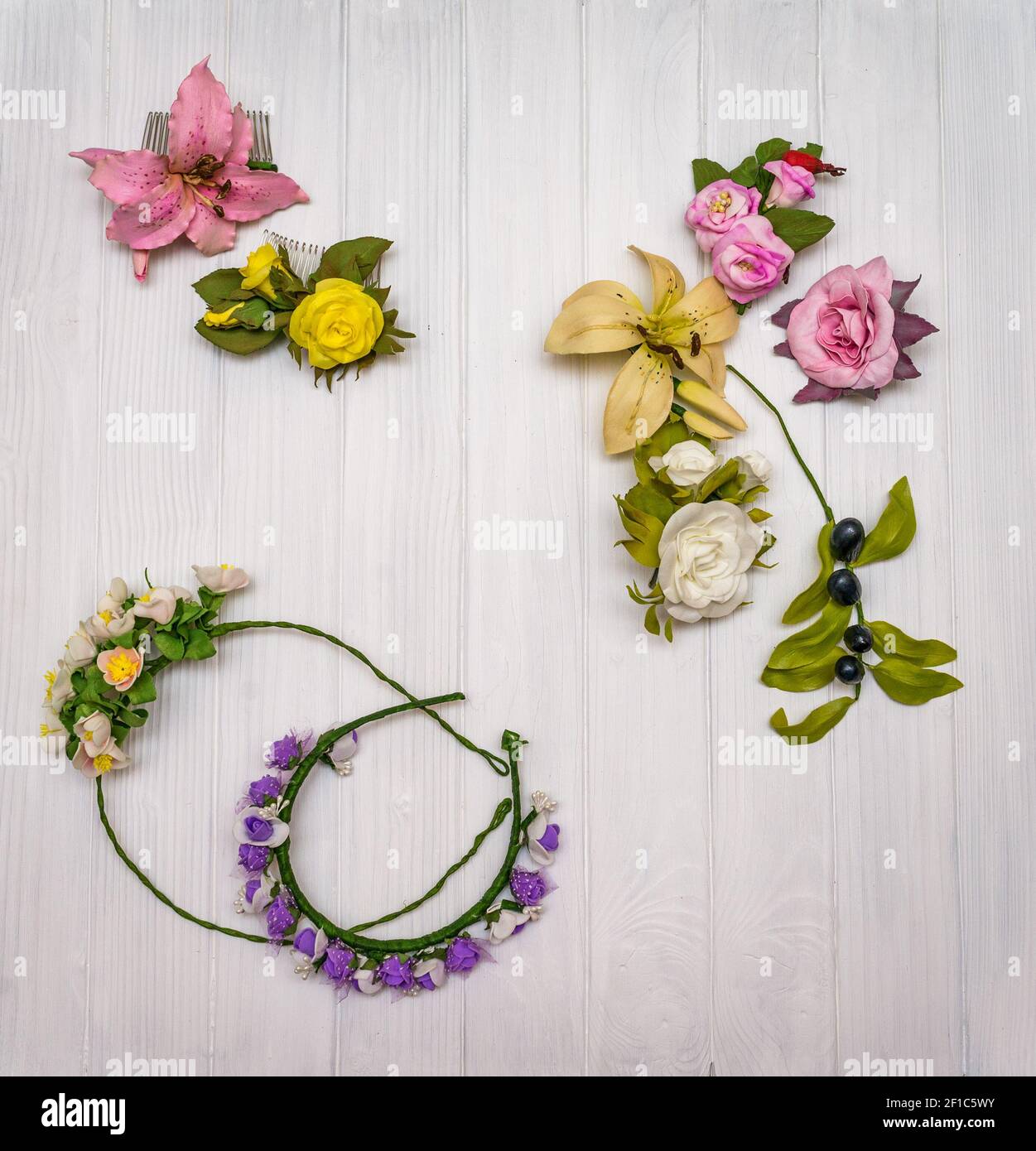 Artificial flowers on a wooden board Stock Photo