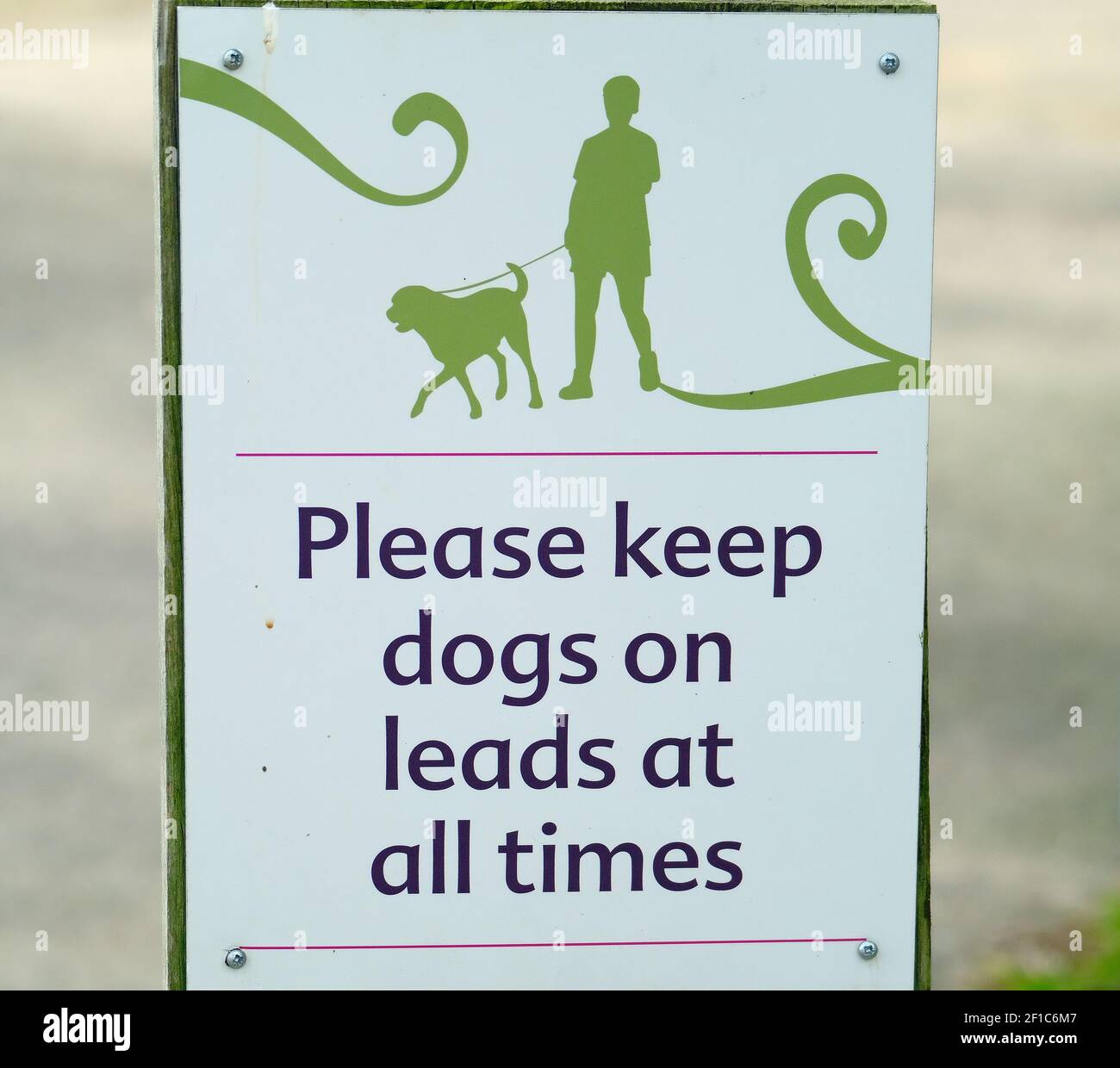 Warning to dog owners in public country park due to free roaming wild and domestic animals. Stock Photo