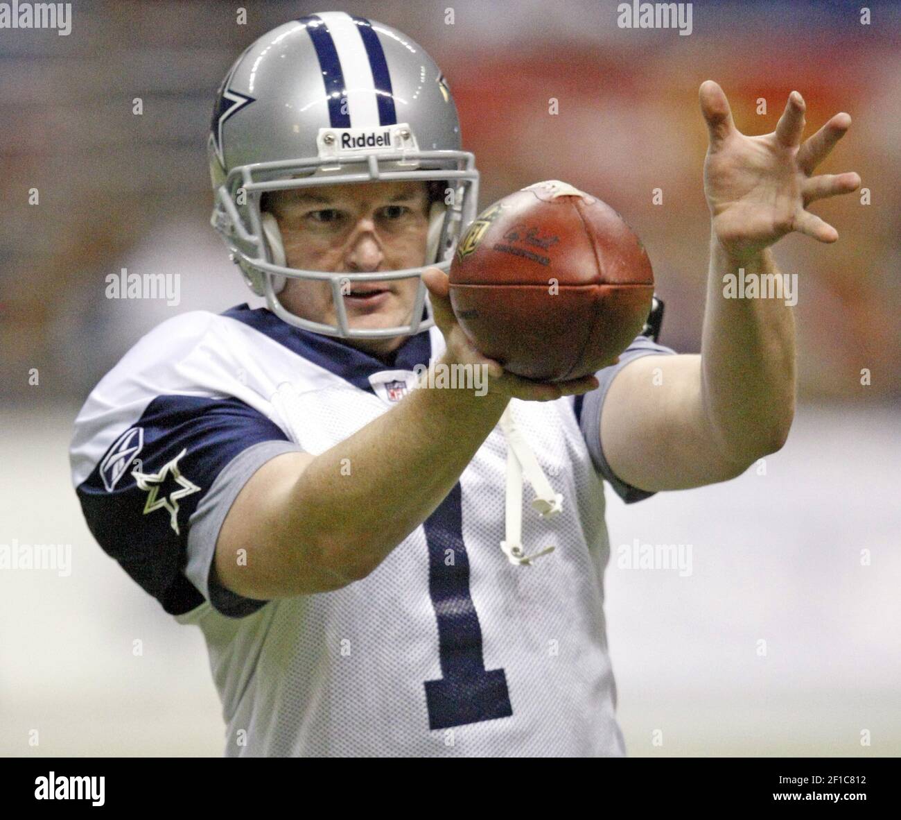 Dallas Cowboys punter Mat McBriar punts against the San Diego