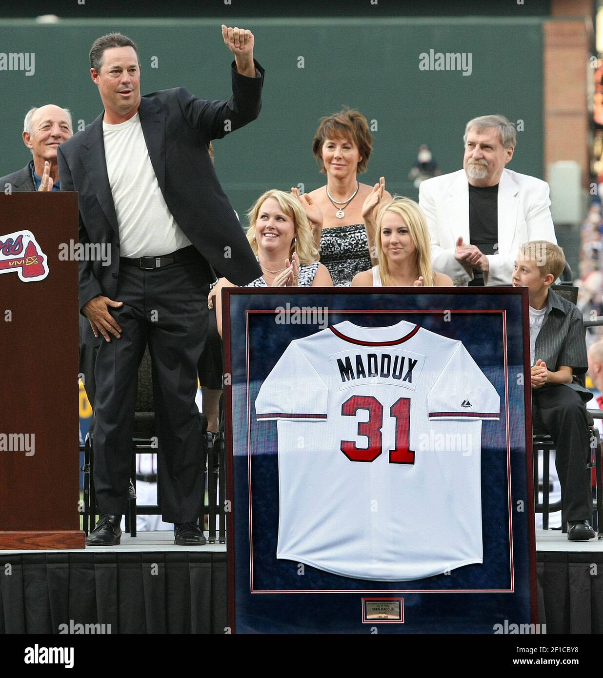 Former Atlanta Braves pitcher Greg Maddux reacts as his jersey is retired  before the Braves game against the New York Mets at Turner Field in  Atlanta, Georgia, Friday, July 17, 2009. (Photo