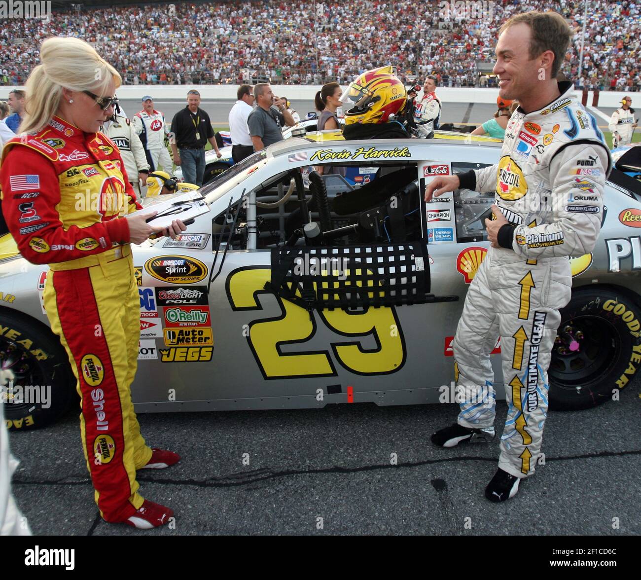 Driver Kevin Harvick, right, shares a laugh with his wife, DeLana Harvick, along pit road before the start of the Coke Zero 400 at Daytona International Speedway in Daytona Beach, Florida, Saturday, July 4, 2009. (Photo by Gary W. Green/Orlando Sentinel/MCT/Sipa USA) Stock Photo