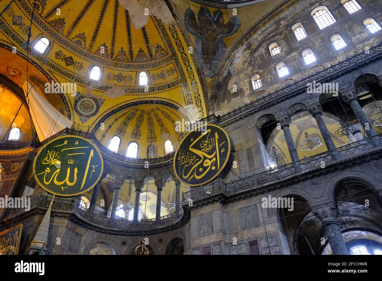 Hagia sophia mosque inside.many etching and gravures name of prophet Muhammad, god, ancient candles. Architectural details of dome and ancient windows Stock Photo