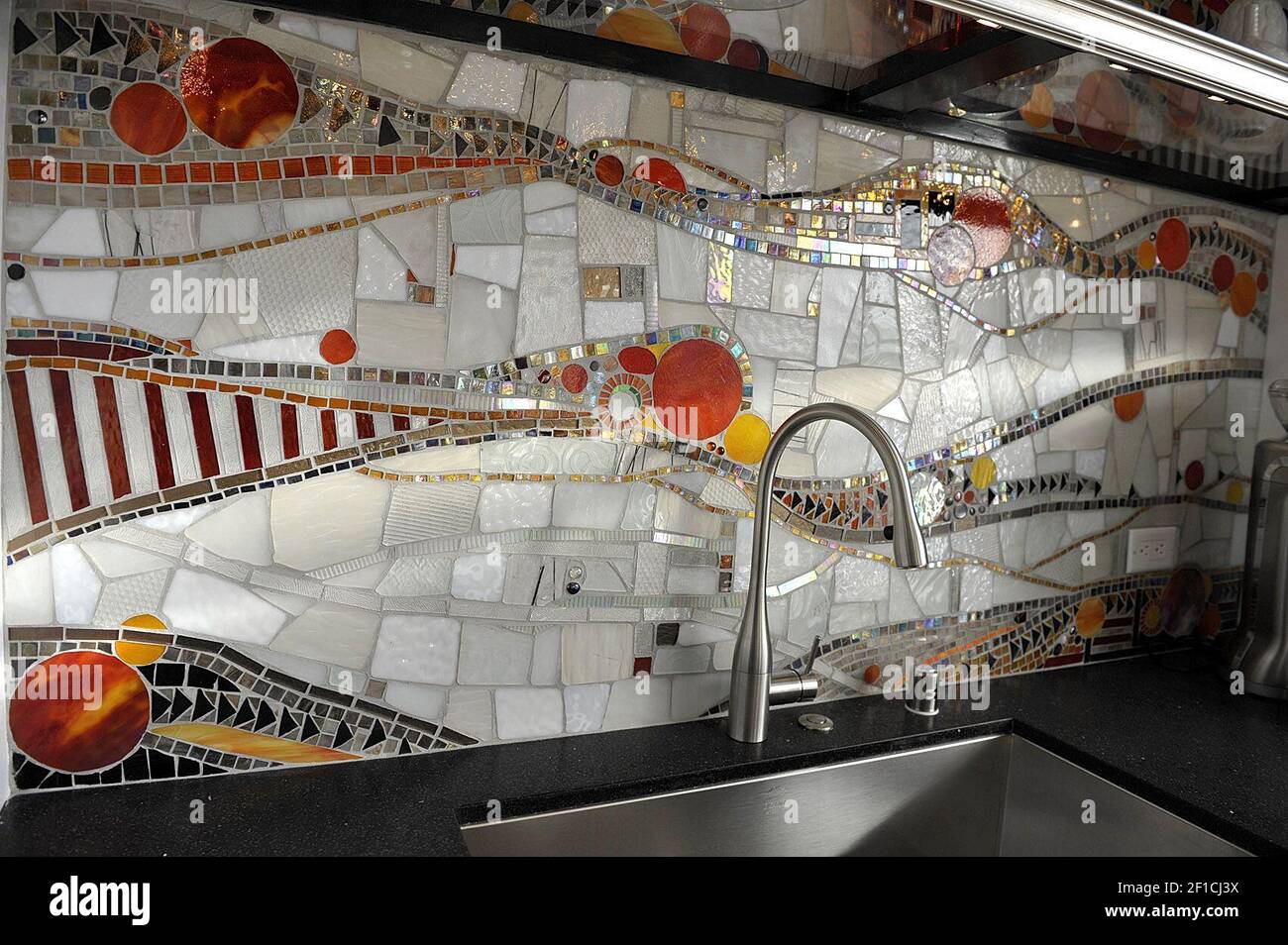 Tile back splash behind kitchen sink in suite 1306, design by Frank