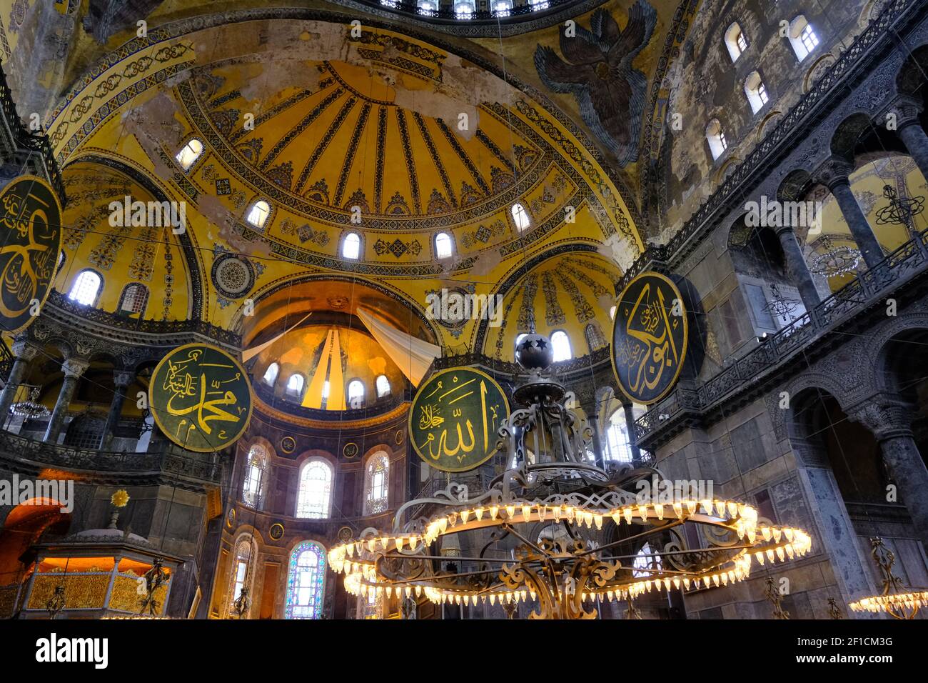 Hagia sophia mosque inside.many etching and gravures name of prophet Muhammad, god, ancient candles. Architectural details of dome and ancient windows Stock Photo