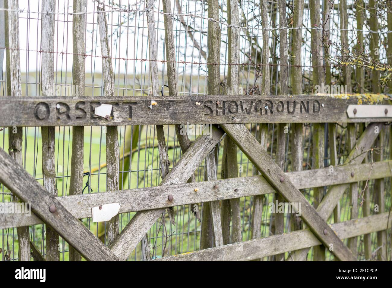 Old gate to Orsett Showground in Orsett, Essex, UK, with carved wording