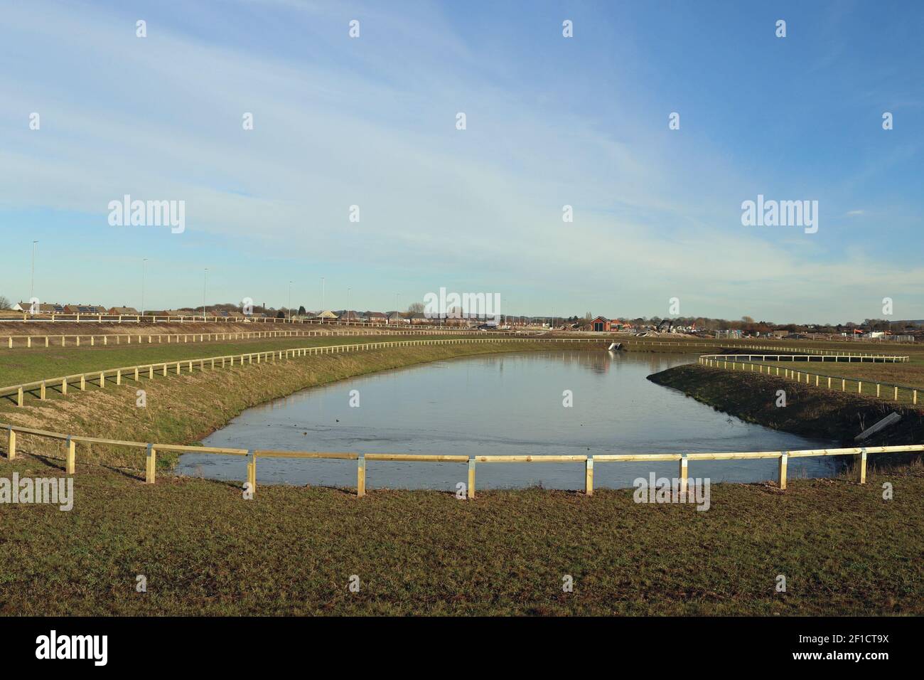 New drainage pond on the former airfield in Burscough which is gradually being repurposed as an industrial estate, 11.2.2021 Stock Photo