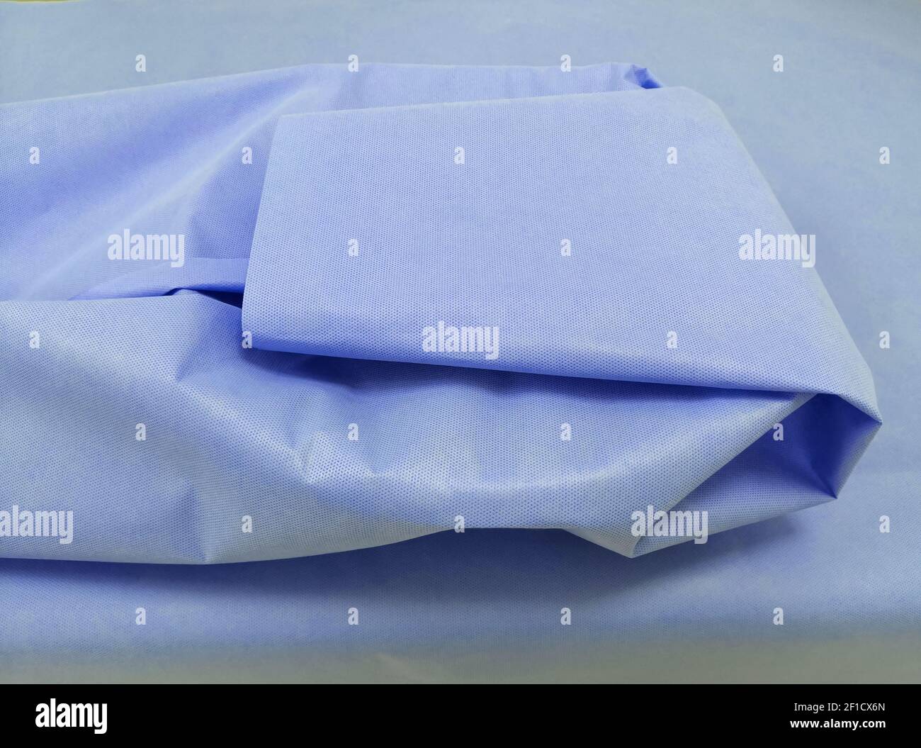 Packing Of Surgical Instrument With Sterilization Blue Drape Sheet. Selective Focus Stock Photo