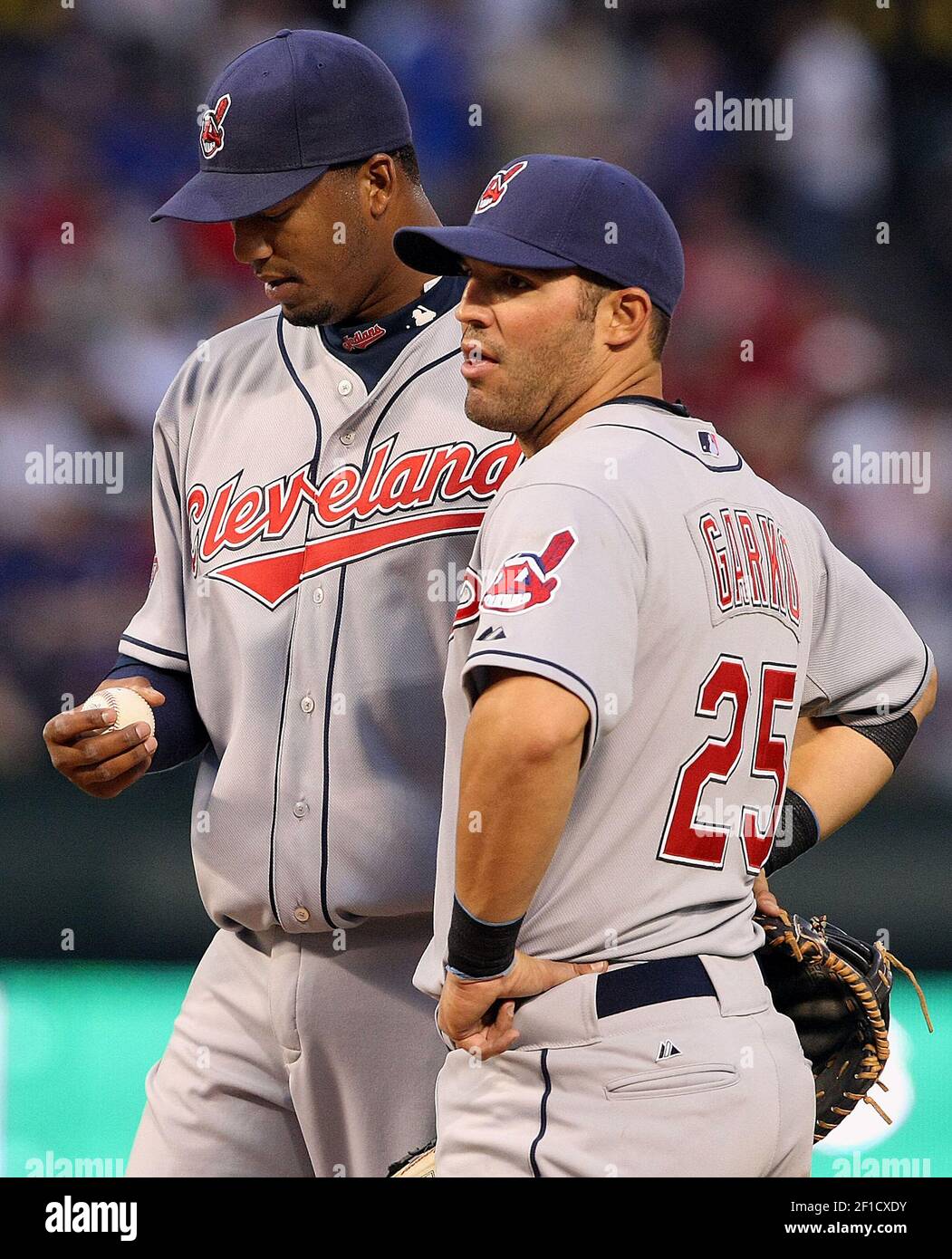 Starting pitcher Fausto Carmona of the Cleveland Indians, left, talks with first baseman Ryan Garko in the first inning against the Texas Rangers on Wednesday, April 8, 2009, in Arlington, Texas. (Photo by Ron Jenkins/Fort Worth Star-Telegram/MCT/Sipa USA) Stock Photo
