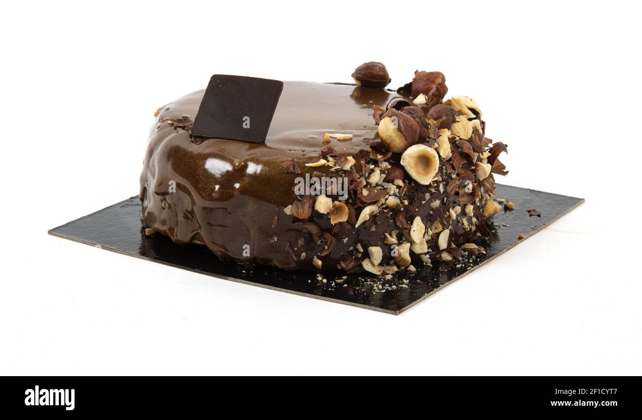 Artisanal chocolate hazelnut cake on a white background Stock Photo