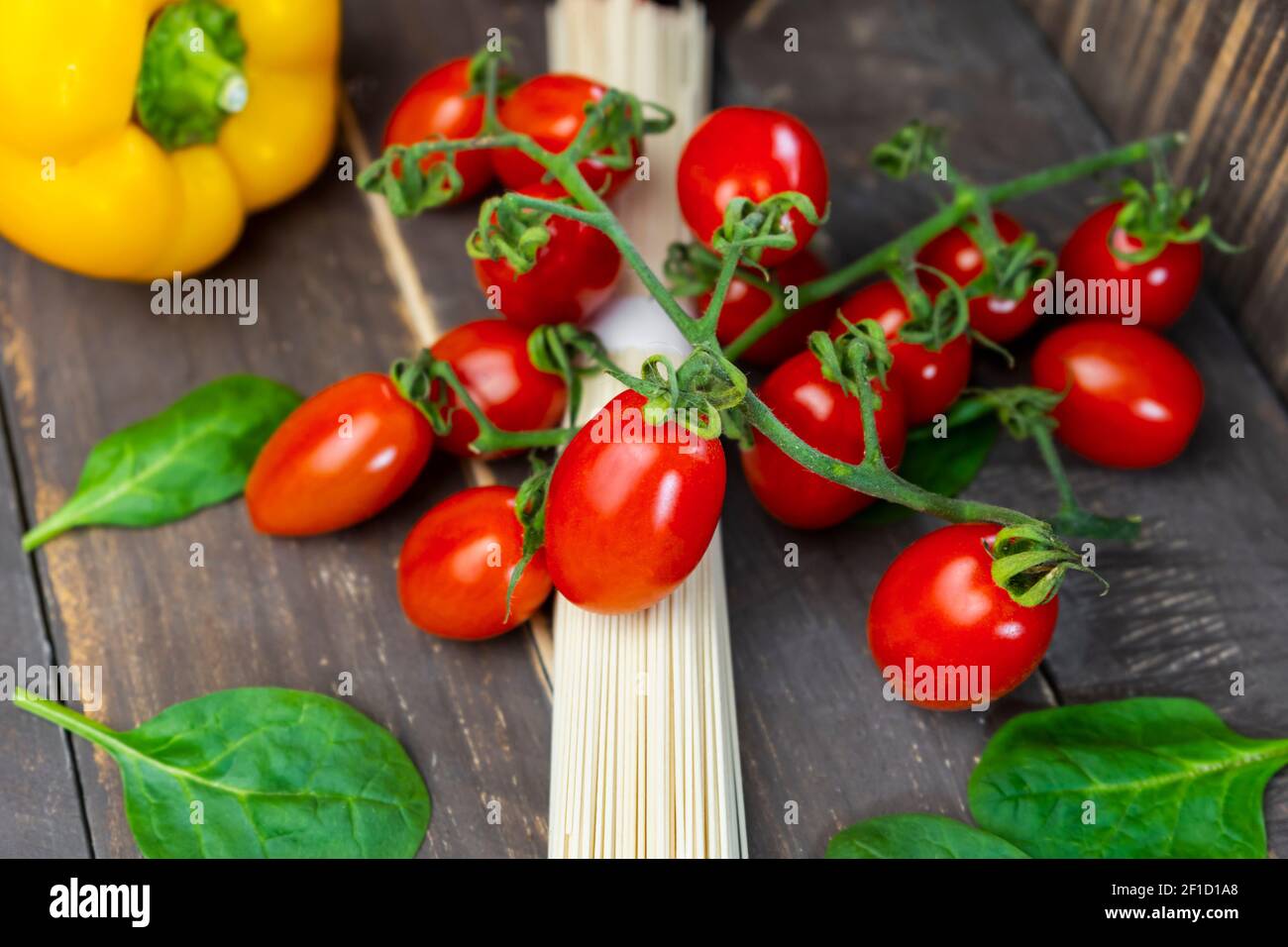 Fresh vegetables with spaghetti pasta on rustic wooden table.Closeup view of dieting food lifestyle ,healthy eating and italian food concept. Stock Photo