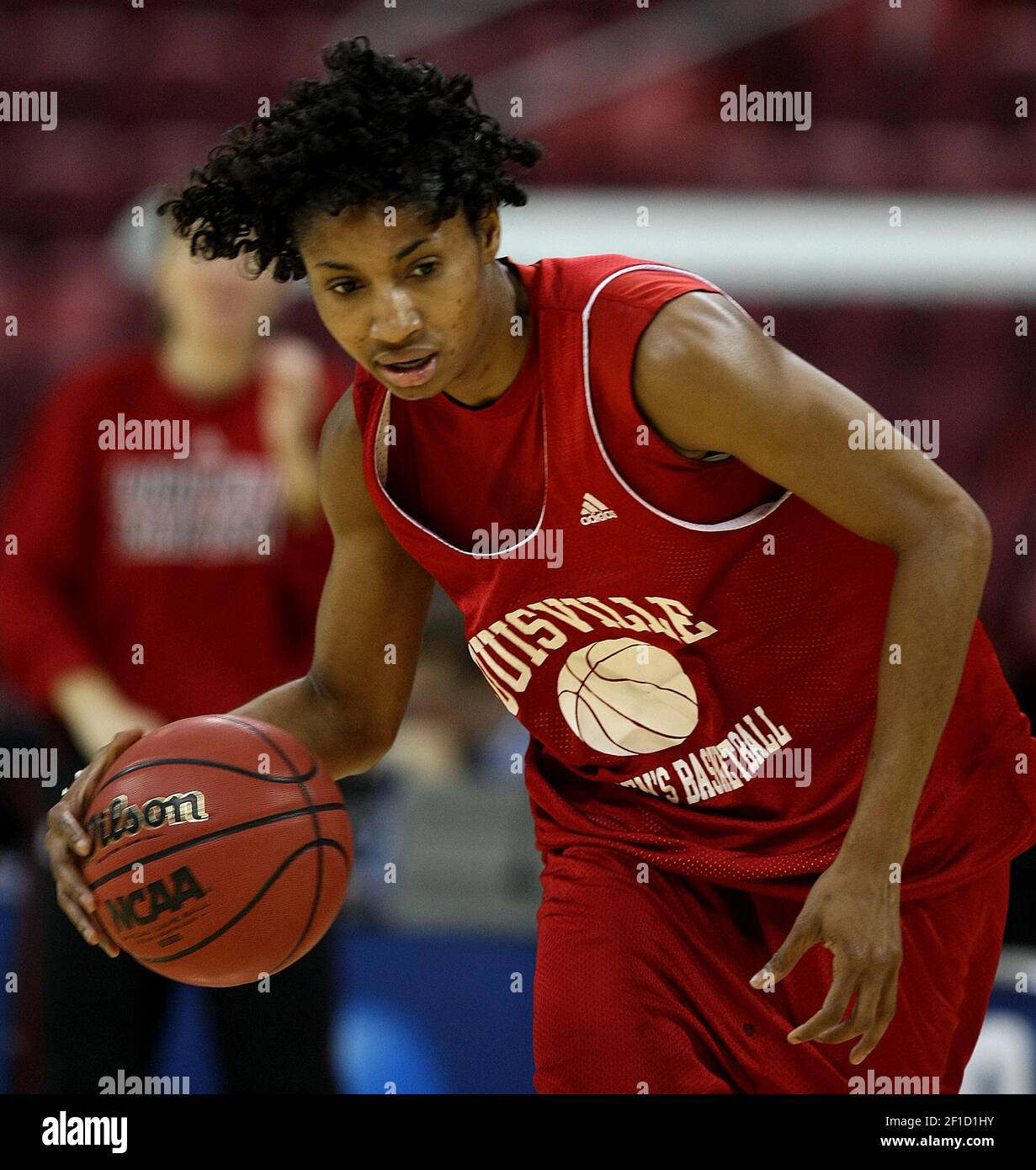 Louisville's Angel McCoughtry brings the ball up court during practice