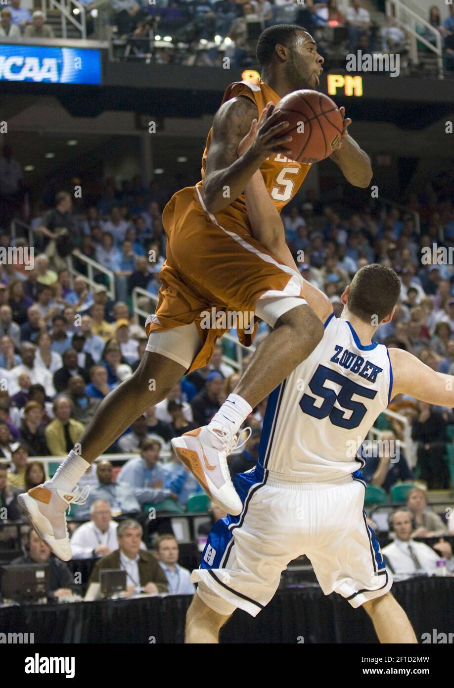 Damion James of Texas (5) crashes into Brian Zoubek of Duke (55) in