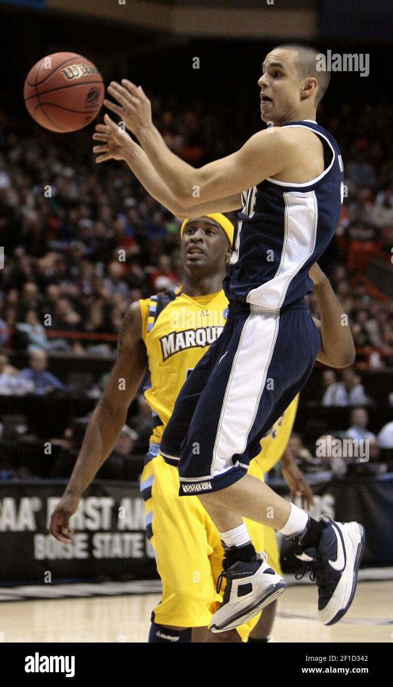 Marquette guard Wesley Matthews (23) could only watch as Utah State guard Jaxon Myaer (25) dished a pass during the Utah State University and Marquette University first round game of the 2009