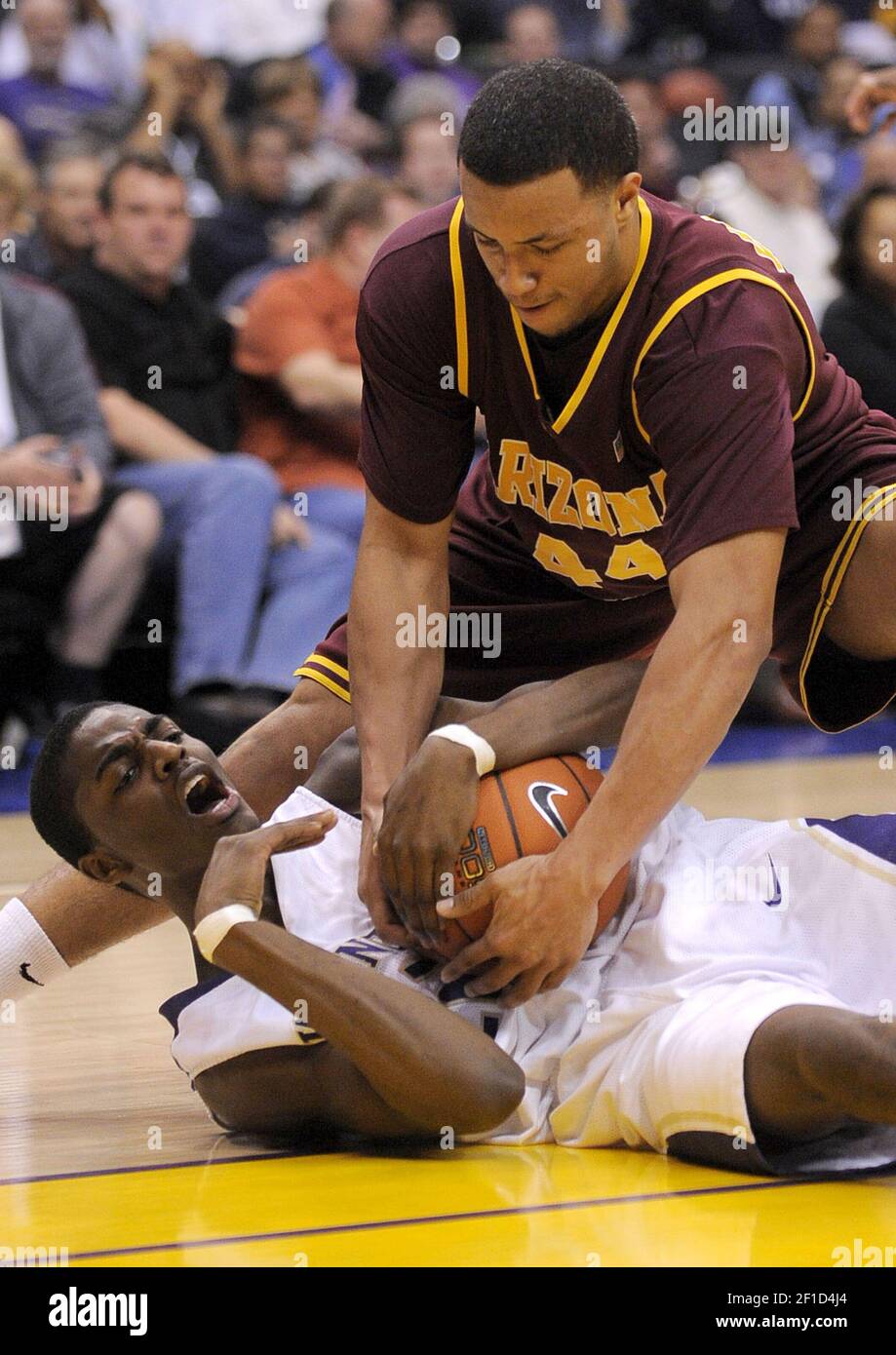 Arizona State's Jerren Ship wrestles for a loose ball with Washington's Justin Holiday during the Pac-10 men's basketball tournament on Friday, March 13, 2009, at the Staples Center in Los Angeles, California. (Photo by Kevin Sullivan/Orange County Register/MCT/Sipa USA) Stock Photo
