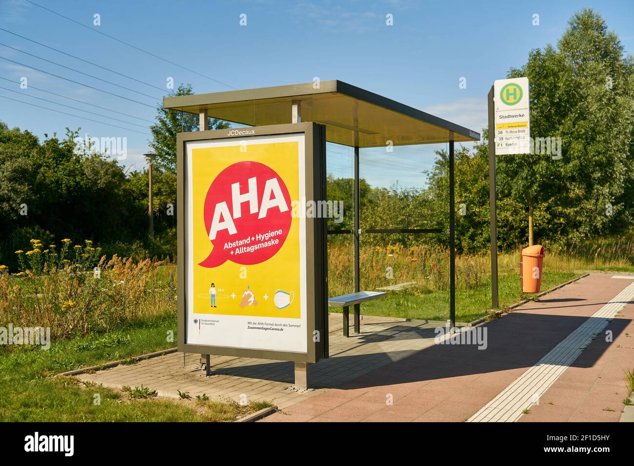 WARNEMUENDE, Germany, July 2020: Billdboard on bus stop promoting German AHA (Abstand, Hygiene, Alltagsmaske) rules (meaning distancing, hygiene, face Stock Photo