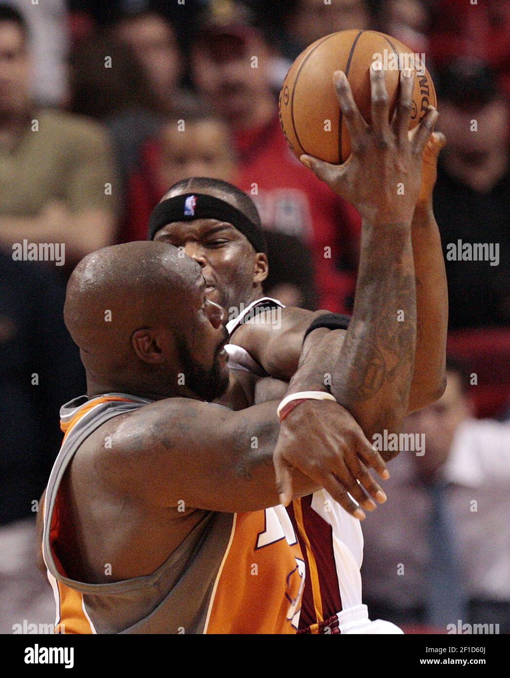 Miami Heat center Jermaine O'Neal, back, fouls Phoenix Suns center ...