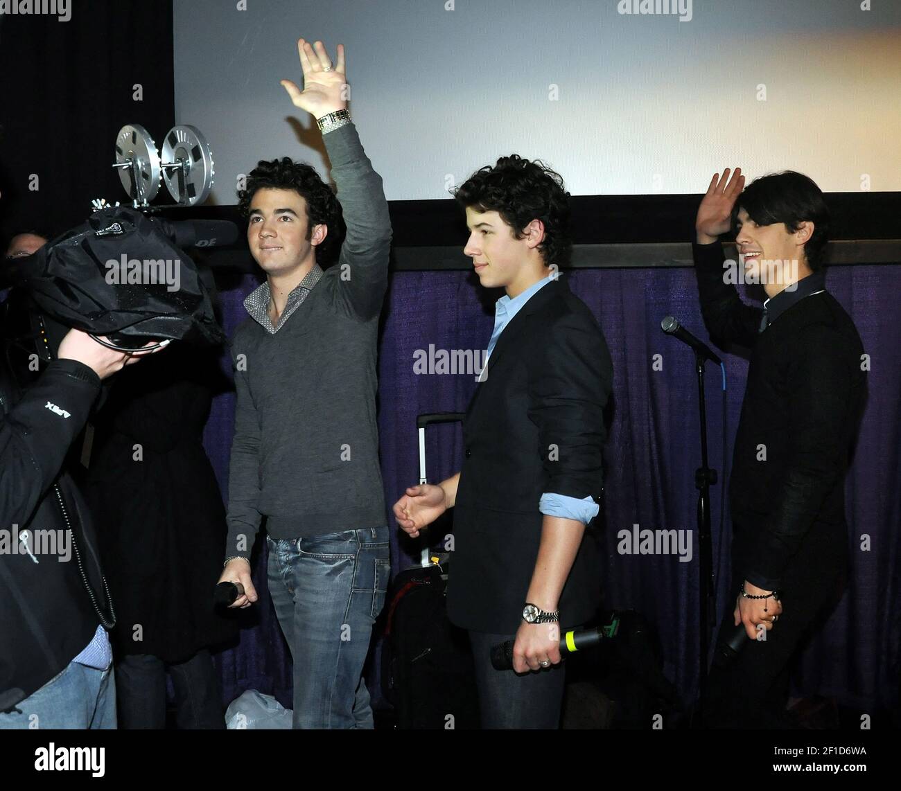 The Jonas Brothers, from left, Kevin, Nick and Joe, briefly walk into ...