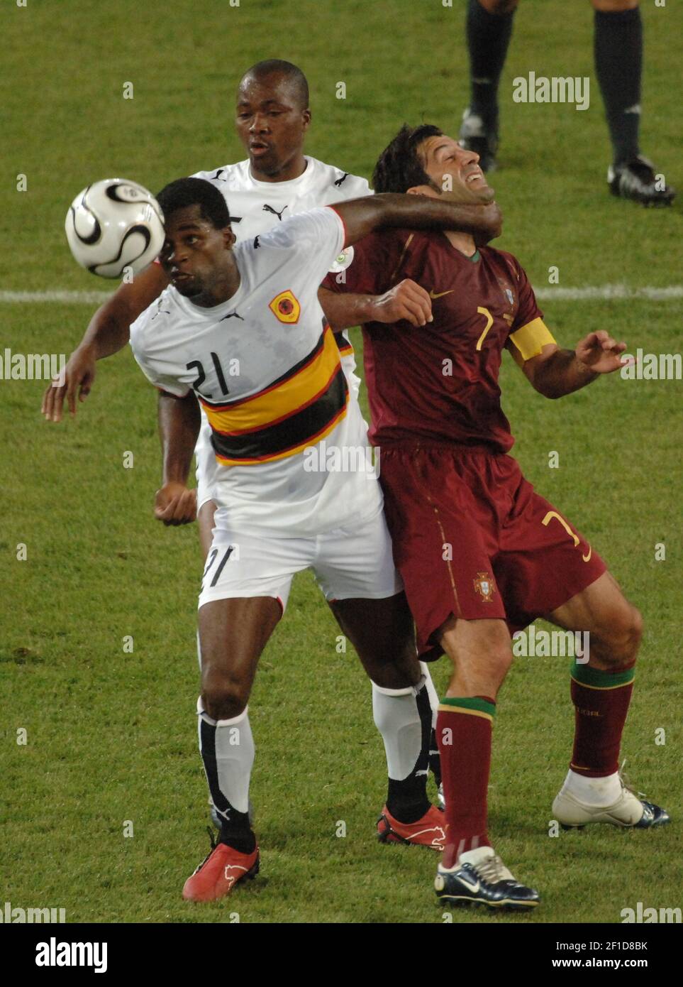 Portugal's Luis Figo and Angola's Delgado in action during the World Cup 2006, Group D, Angola vs Portugal in Cologne, Germany on June 11, 2006. Portugal won 1-0. Photo by Gouhier-Hahn-Orban/Cameleon/ABACAPRESS.COM Stock Photo