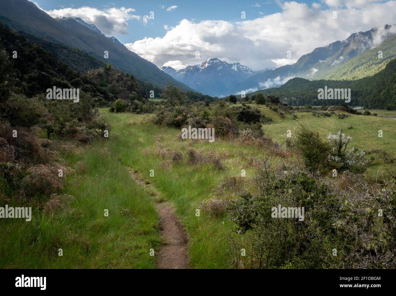 Picturesque alpine valley with dominant mountain on its end, shot on Caples Track, New Zealand Stock Photo