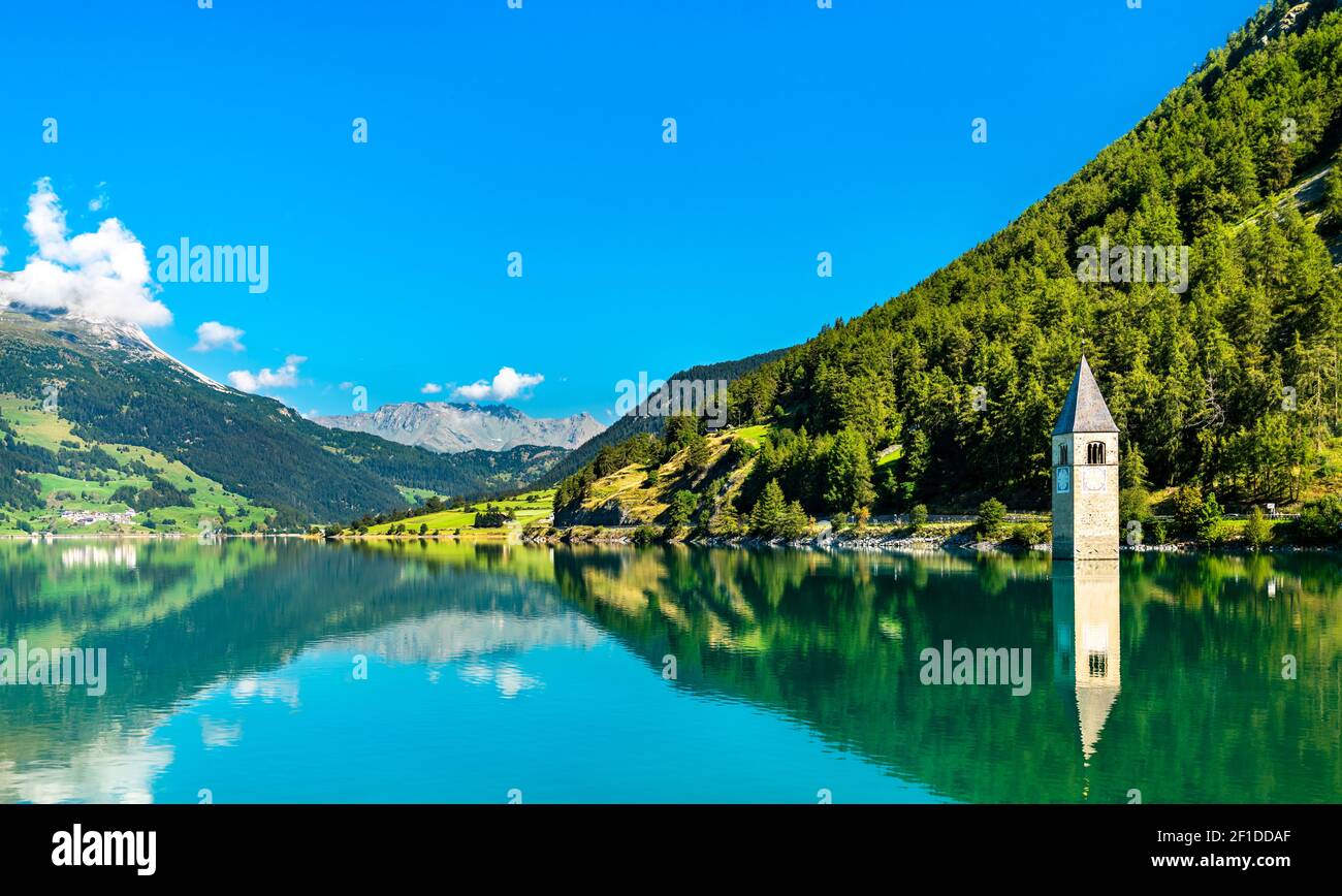 Submerged Bell Tower of Curon on Lake Reschen in South Tyrol, Italy Stock Photo