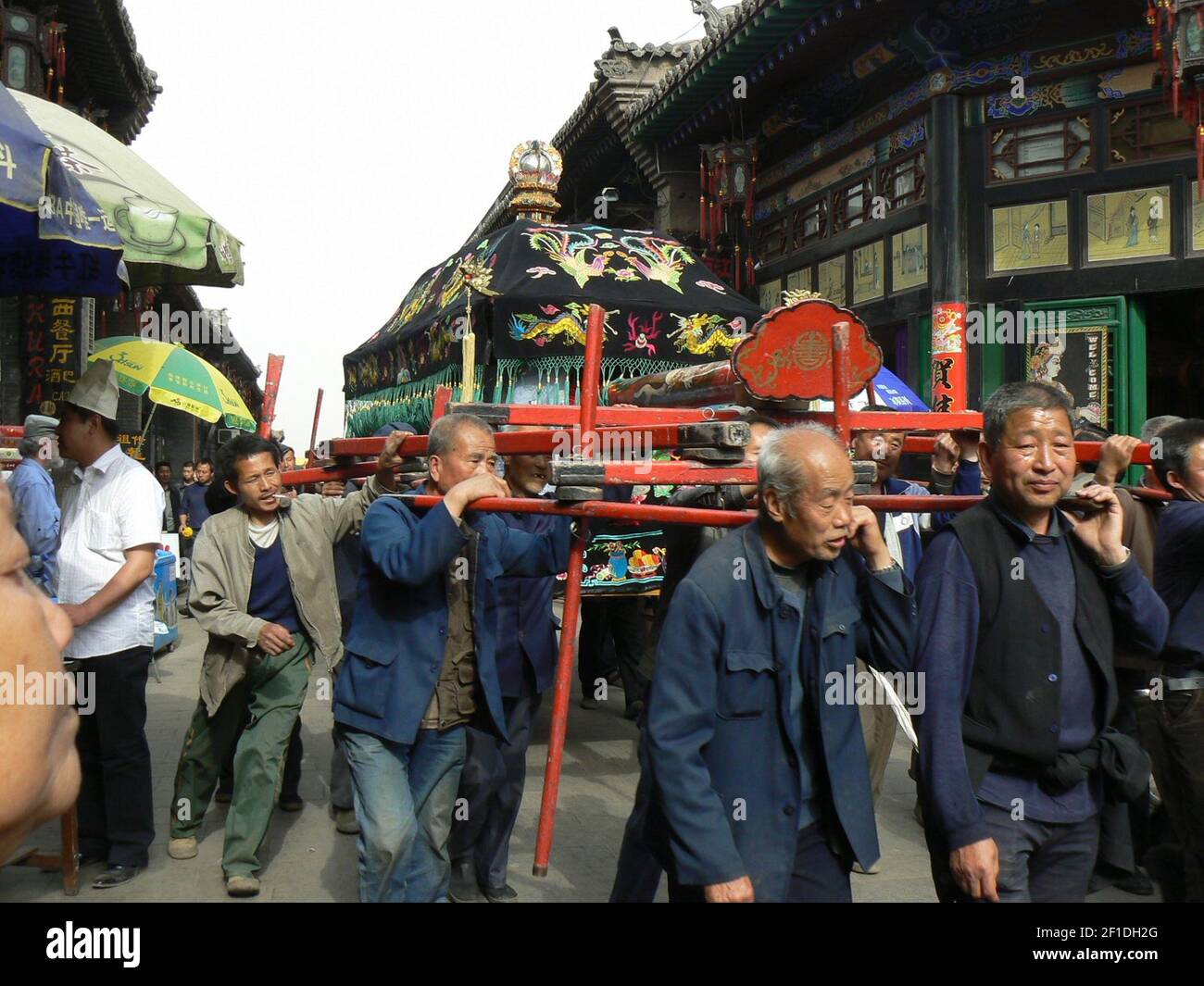 Local men lead a funeral procession through Pingyao, China. The town has many museums, but the best sites are snapshots of every day life. (Photo by Carol Pucci/Seattle Times/MCT/Sipa USA) Stock Photo