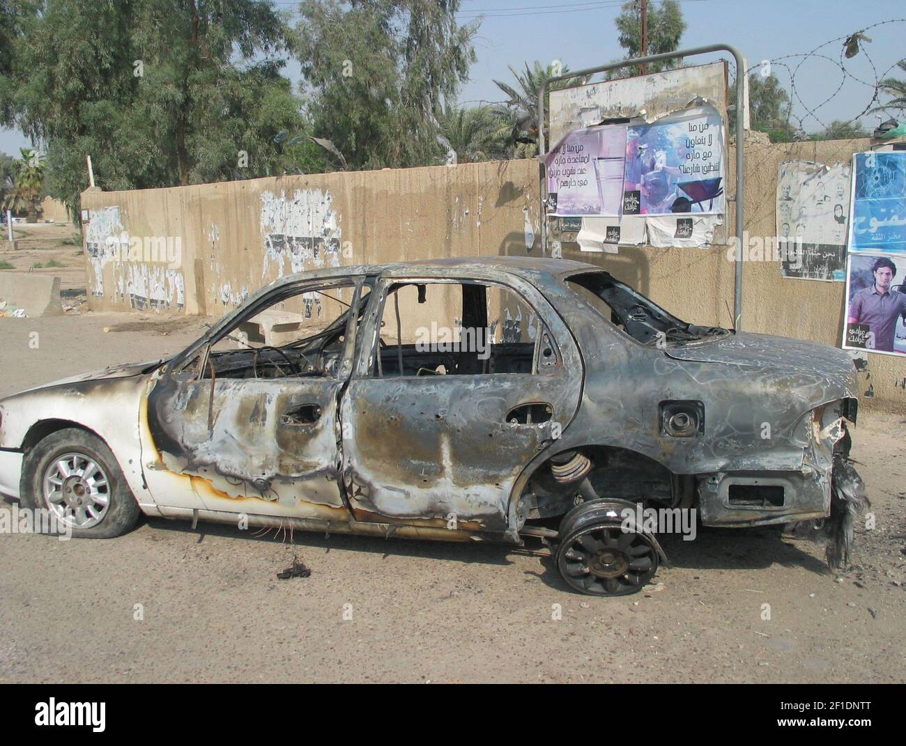 A car sits at a traffic circle in central Baghdad where a shootout with private security company Blackwater left 17 dead in 2007. Witnesses said a woman and child were killed in the car. On April 13, 2015, a federal judge sentenced one former Blackwater security guard to life in prison and three others to 30 years over the incident. (Photo by Hussein Kadhim/TNS) *** Please Use Credit from Credit Field *** Stock Photo