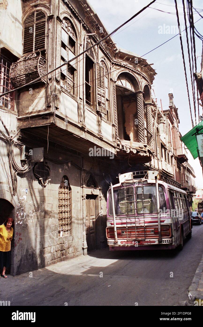 A bus drives through the narrow streets in central Damascus. Ancient monuments across Syria are under threat as a result of the civil war which began in 2011. Temples in the Roman city of Palmyra have been attacked by Islamic State, while other sites have suffered shelling from government forces and been stripped by looters. (Photo by Dominic Dudley / Pacific Press) *** Please Use Credit from Credit Field *** Stock Photo