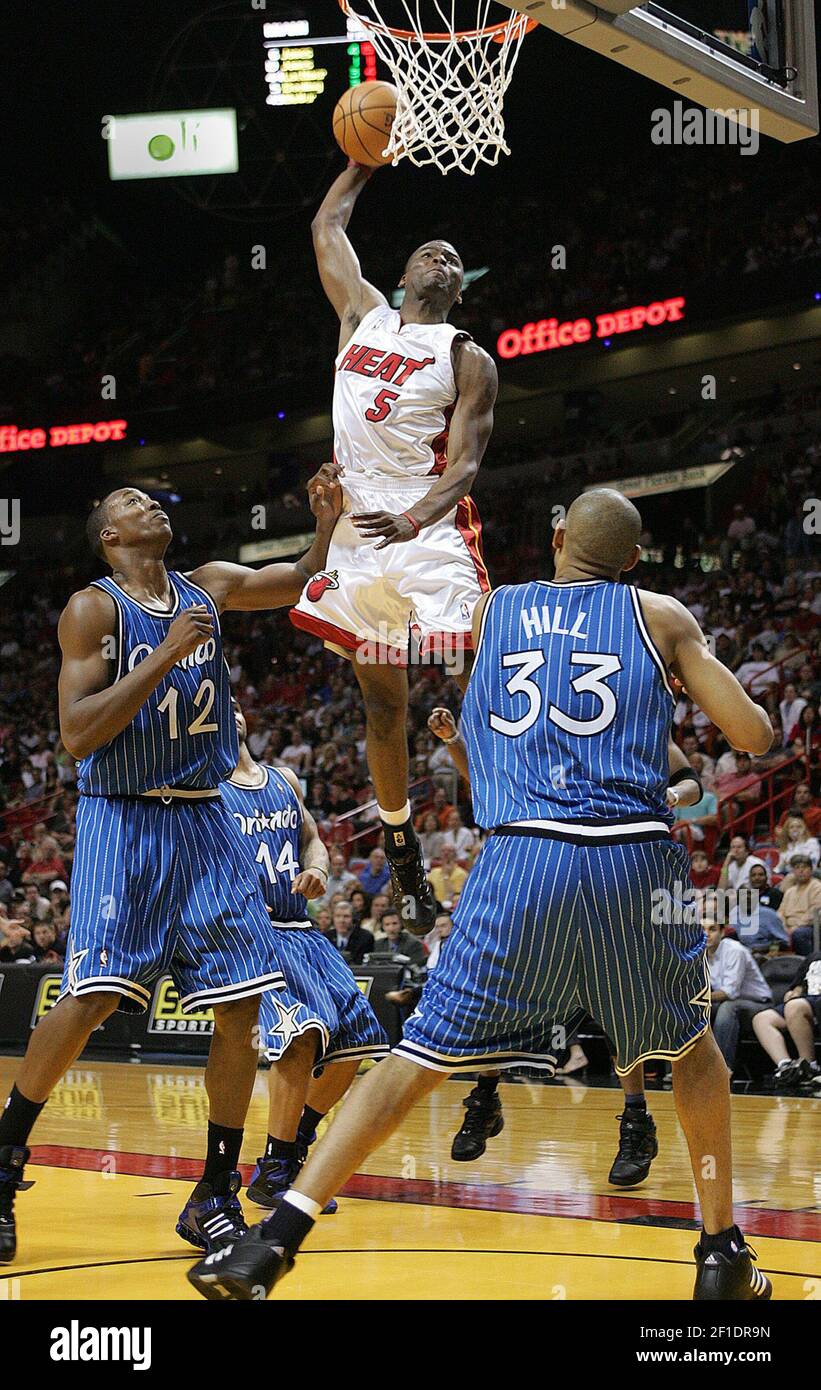 Keyon Dooling (5) of the Miami Heat moves in for a slam dunk over the Orlando Magic defense during fourth quarter action at American Airlines Arena in Miami, Fla., on Feb. 26, 2005. (Photo by Al Diaz/Miami Herald/TNS/Sipa USA) Stock Photo