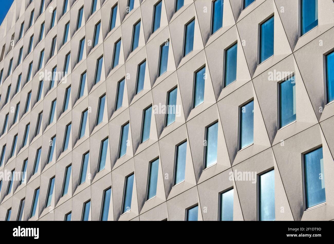 The Hague, The Netherlands, February 13, 2021: the facade of the apartments and municipal offices at Layweg, with trapezoid prefab concrete elements Stock Photo