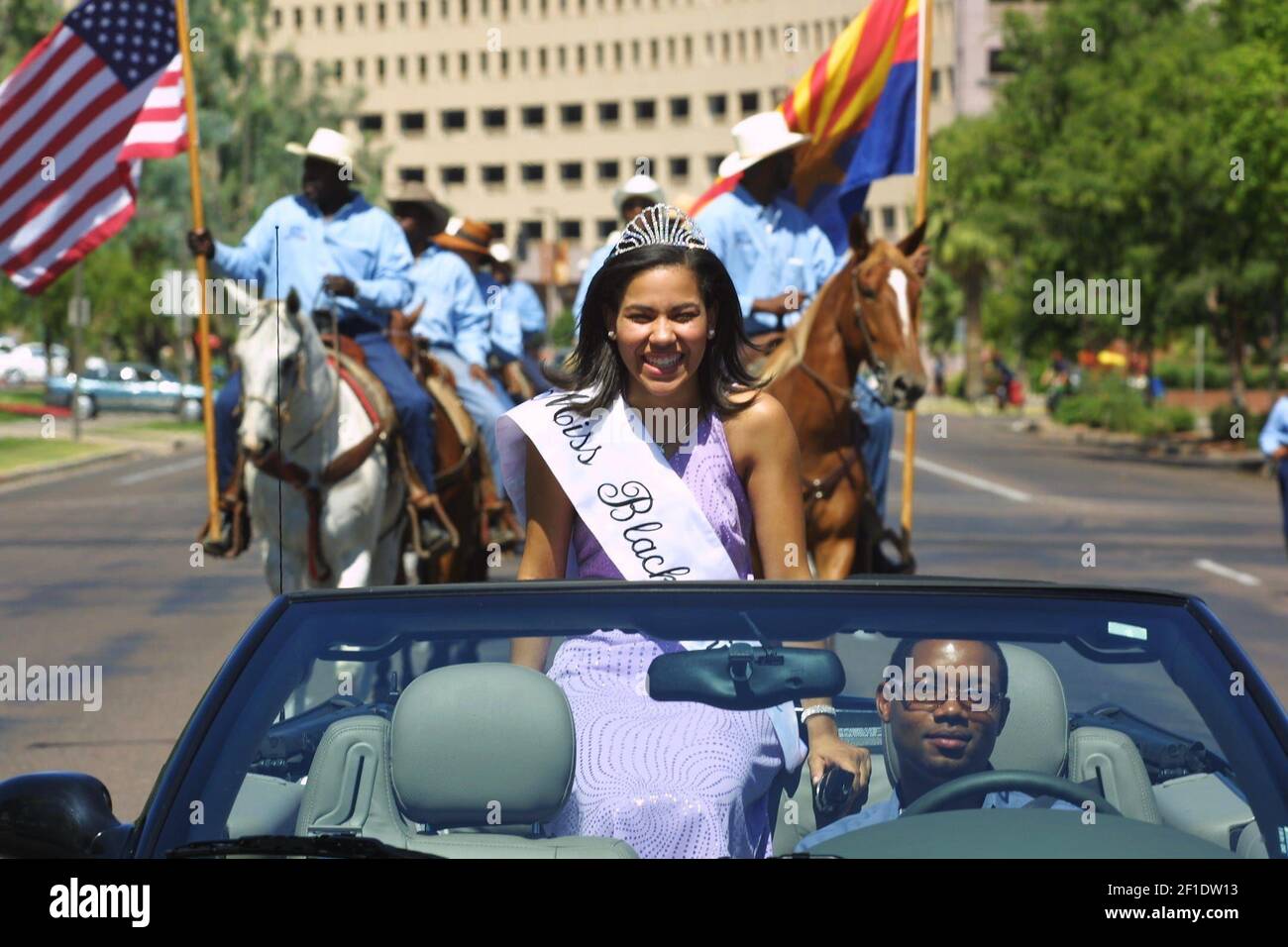 2001: Adrien Nash drives Brianna Simmons, Miss Black Arizona, down Jefferson Street during the Juneteenth Parade in Phoenix, Saturday. They were followed by the Southwest Riding Club. Juneteenth is celebrated as a commemoration of the ending of slavery in the United States. On June 19, 1865 Union soldiers, led by Major General Gordon Granger, arrived in Galveston, TX to spread the news that the war had ended and that the enslaved were now free. The announcement came two year after President Abraham Lincoln’s Emancipation Proclamation given on January 1, 1983, which was not enforced in Texas du Stock Photo