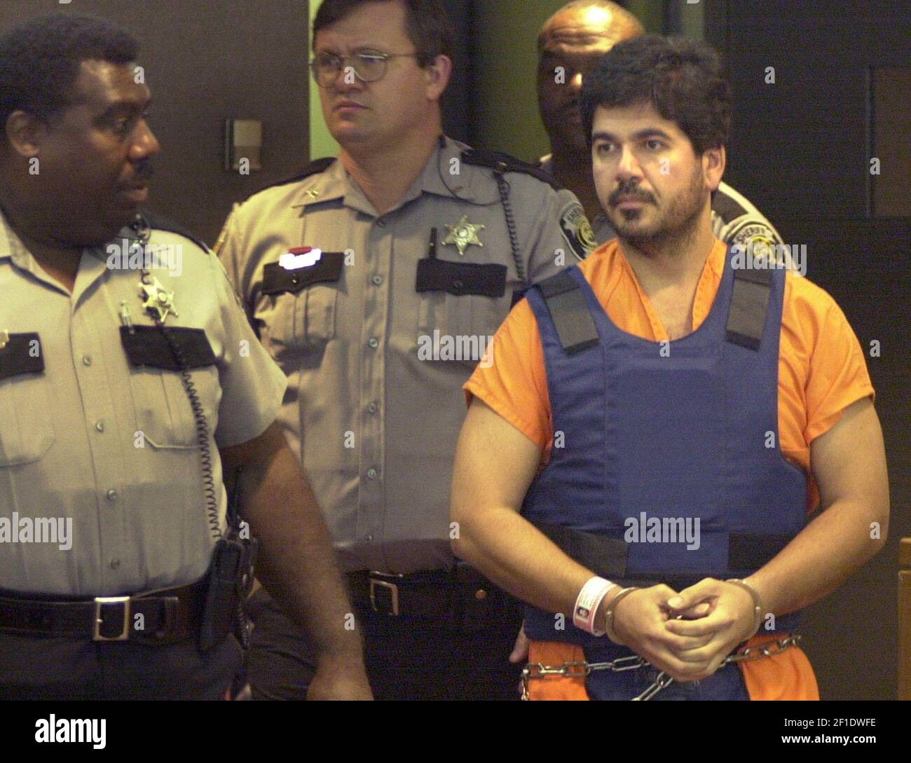 Oct 26, 2000; Augusta, GA, USA; Reinaldo J. Rivera (right), who is charged with the murders of four women in Georgia and South Carolina, is led by Richmond County Sheriff's deputies into the courtroom of Judge H. Scott Allen in Augusta, Ga., on Thursday, October 26, 2000, to face extradition to South Carolina. Mandatory Credit: Jonathan Ernst/The Augusta Chronicle via USA TODAY NETWORK/Sipa USA Stock Photo