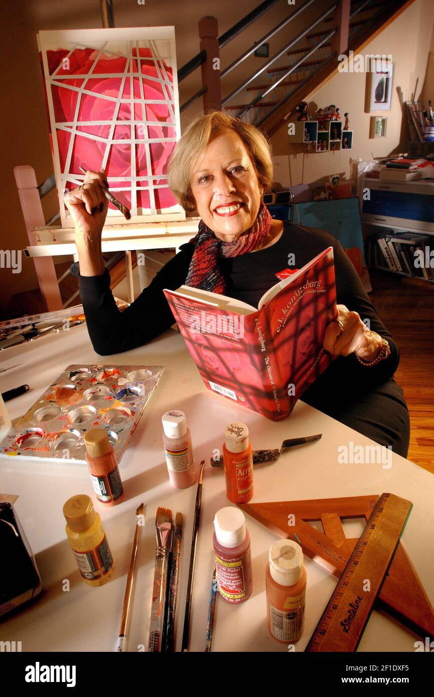 Feb 9, 2004; Ponte Vedra, FL, USA; Newberry Medal-winning writer and artist E.L. Konigsburg poses for a photo with her book 'The Outcasts of 19 Schuyler Place', for which she painted the cover art, in her Ponte Vedra, Fla., studio. Mandatory Credit: Jon Fletcher/Florida Times-Union via USA TODAY NETWORK/Sipa USA Stock Photo