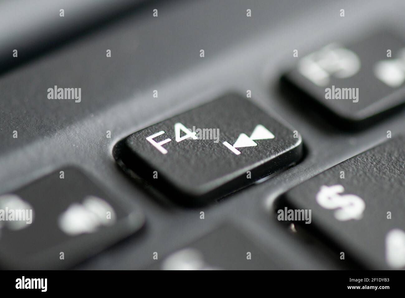 F4 and play previous track key on a laptop keyboard Stock Photo - Alamy