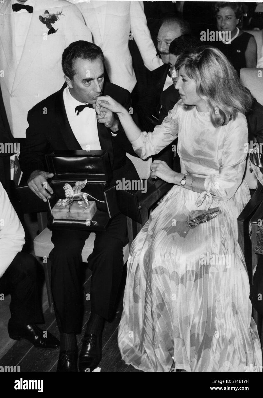 Italian director Michelangelo Antonioni kisses the hand of the Italian  actress Monica Vitti (Maria Luisa Ceciarelli) after receiving the Golden  Lion Award for best film for his movie Red Desert (Deserto rosso).