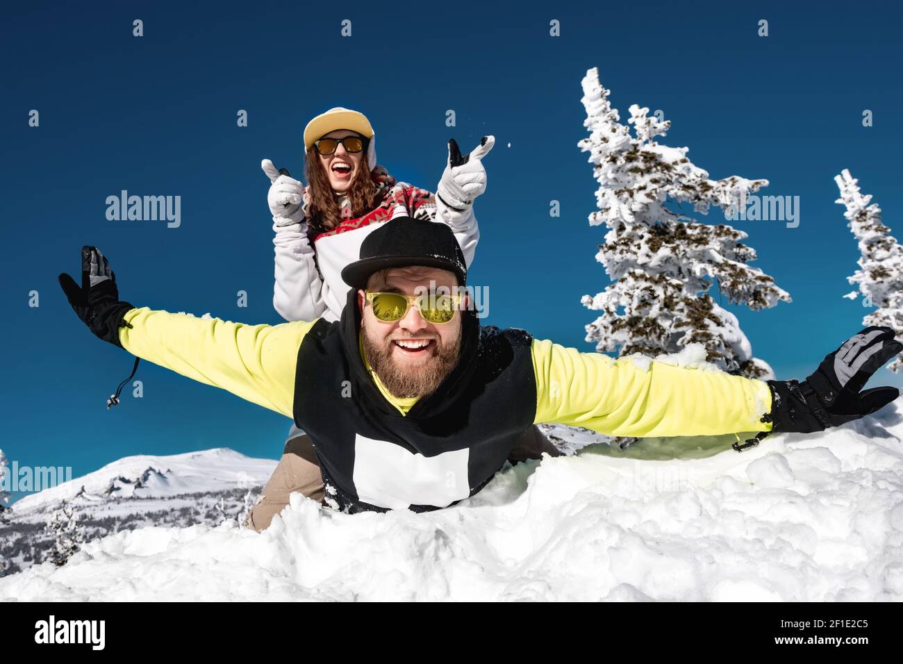 Couple snowboarders or skiers are having fun at ski resort. Sheregesh, Siberia, Russia Stock Photo