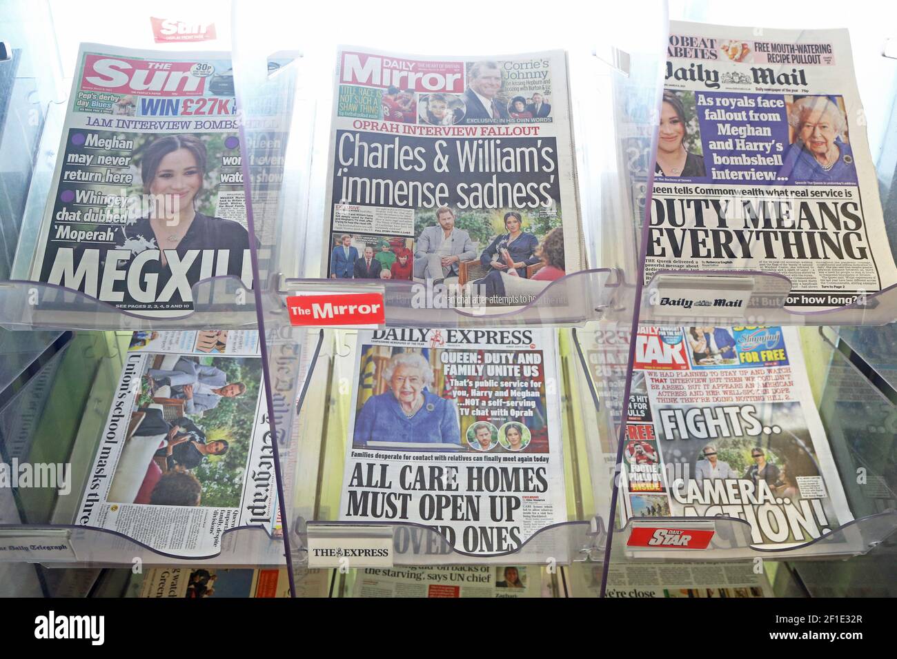 The front pages of newspapers on sale at a garage in Dover, Kent. The Duke and Duchess of Sussex have plunged the monarchy into a crisis, accusing an unnamed royal of racism, suggesting the family were jealous of Meghan and revealing that she contemplated taking her own life while pregnant. Picture date: Monday March 8, 2021. Stock Photo