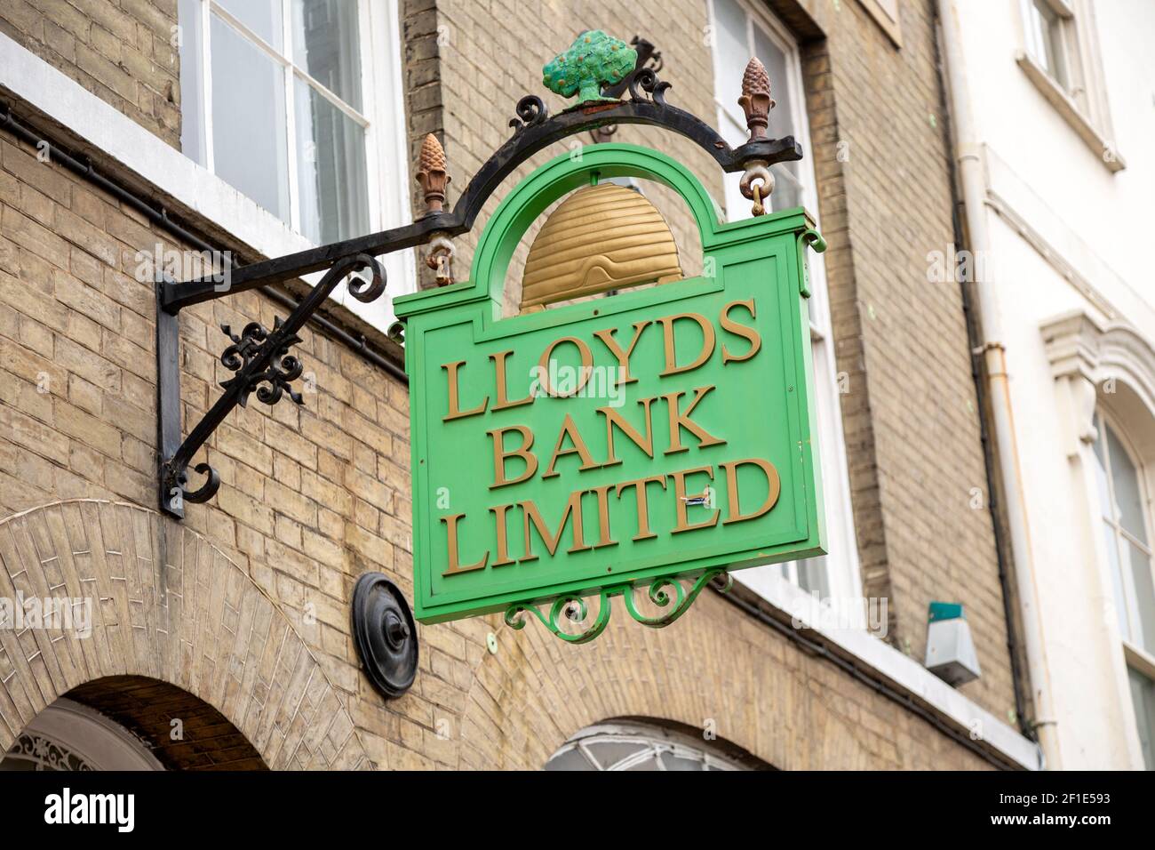 Old style historic vintage Llloyds Bank Limited sign on wall outside High Street branch, UK Stock Photo