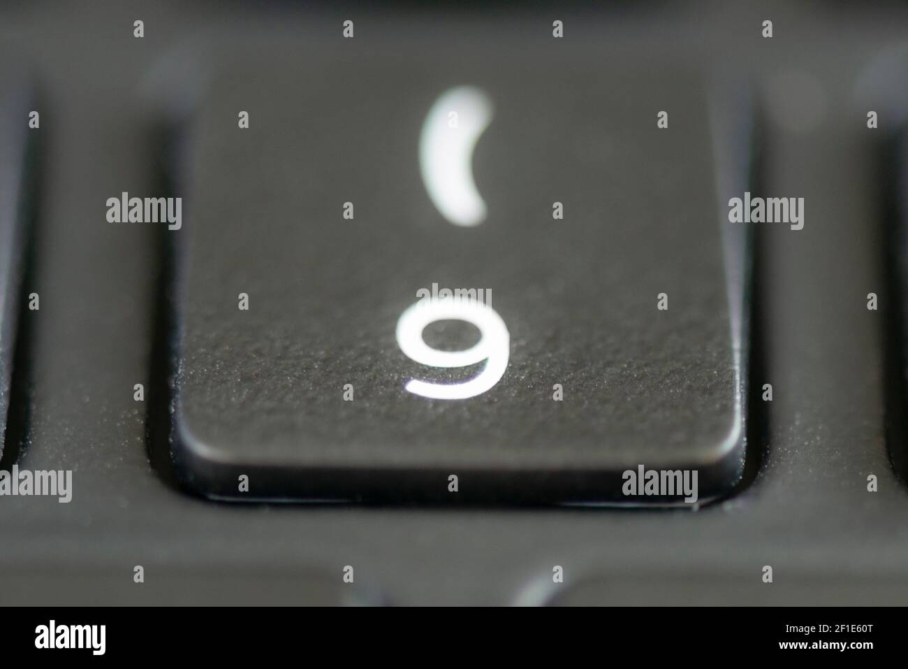 9 and bracket key on a laptop keyboard Stock Photo Alamy