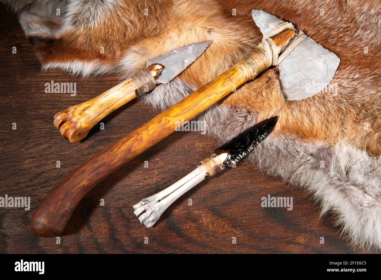 Stone Age Tools on wooden Background Stock Photo