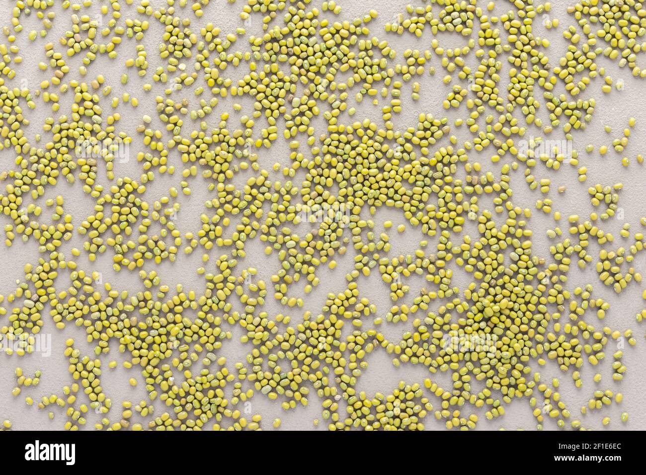 Legumes are scattered in the background, natural background of mung beans , top view Stock Photo